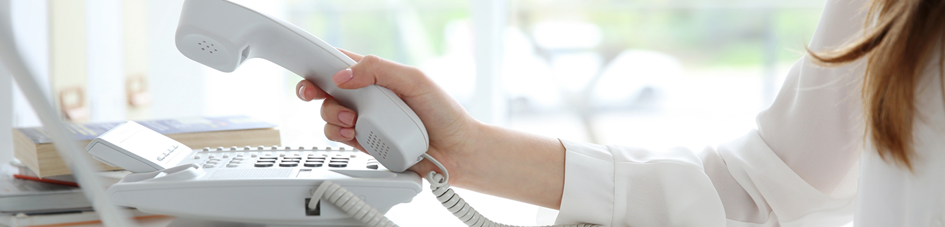 Dental team member answering the phone