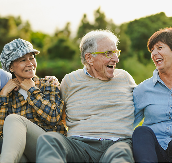 Group of seniors laughing in the sun