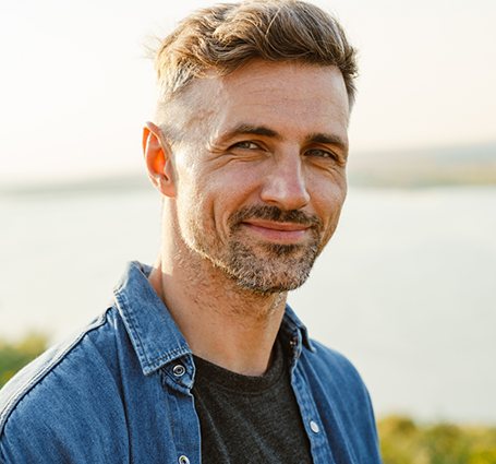 Smiling man in a denim shirt