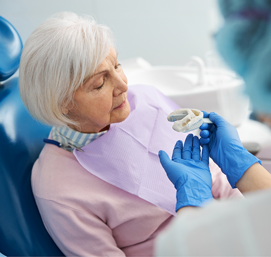 Senior woman being fitted for dentures