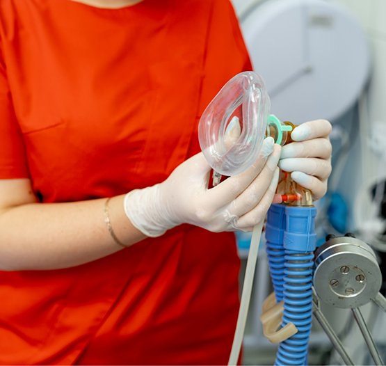 Dentist holding a nose mask for nitrous oxide