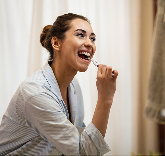 Woman brushing her teeth