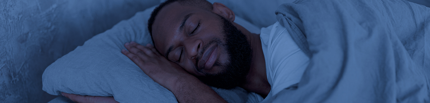 Man sleeping soundly after sleep apnea treatment in Spring