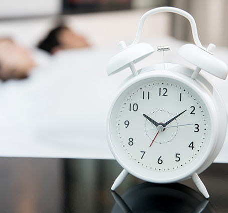 Alarm clock on a bedside table