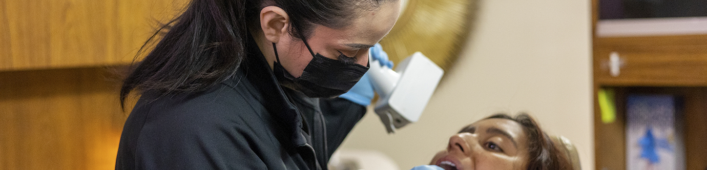 Dentist giving a patient a dental exam