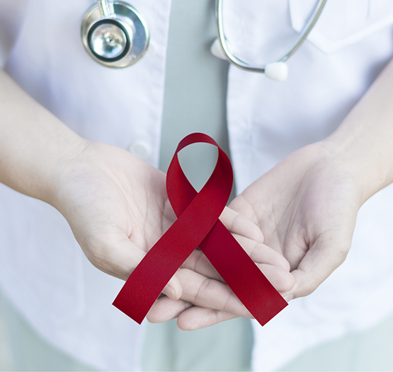 Dentist holding a dark red ribbon