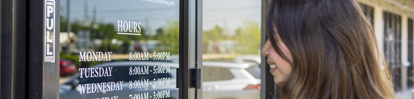 Woman walking into Spring Dentist office