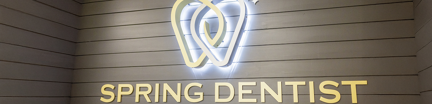 Spring Dentist sign on the wall of a dental office in Spring