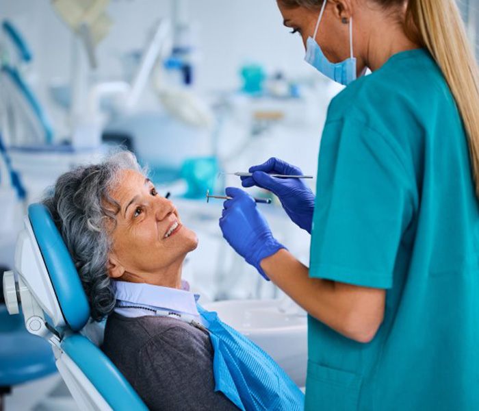 a patient visiting her implant dentist for salvage treatment