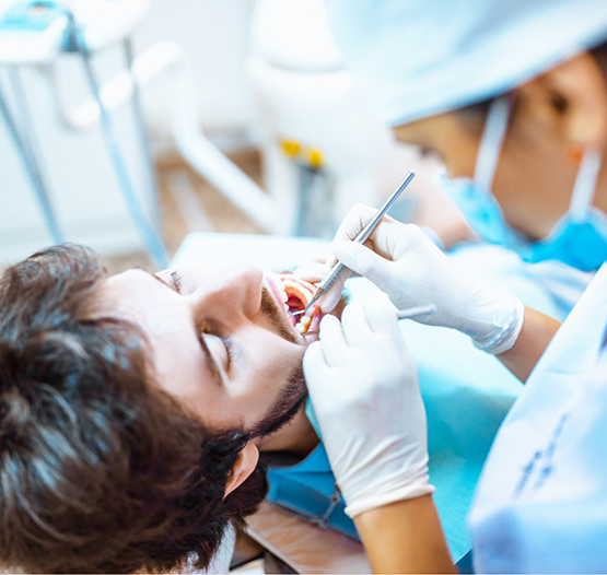 Dentist examining a patient's teeth